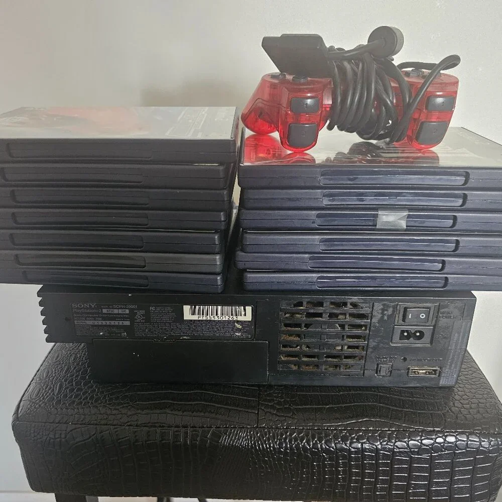 Playsation 2 (PS2 Fat) with controllers and games and PS2 Slim